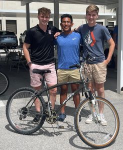 Three college-bound Champions For Learning students receive bikes