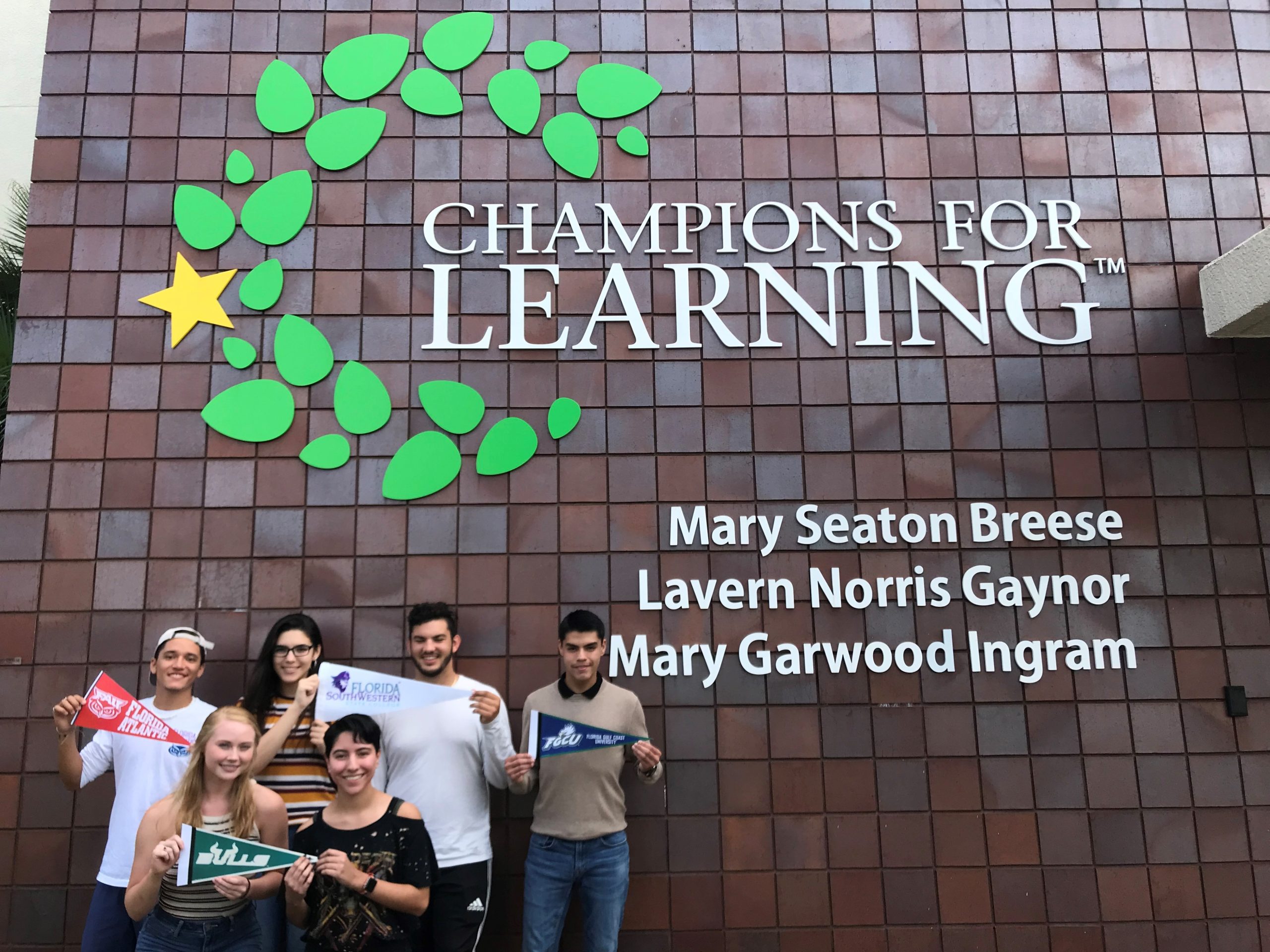 Seniors holding college pennant | Champions For Learning